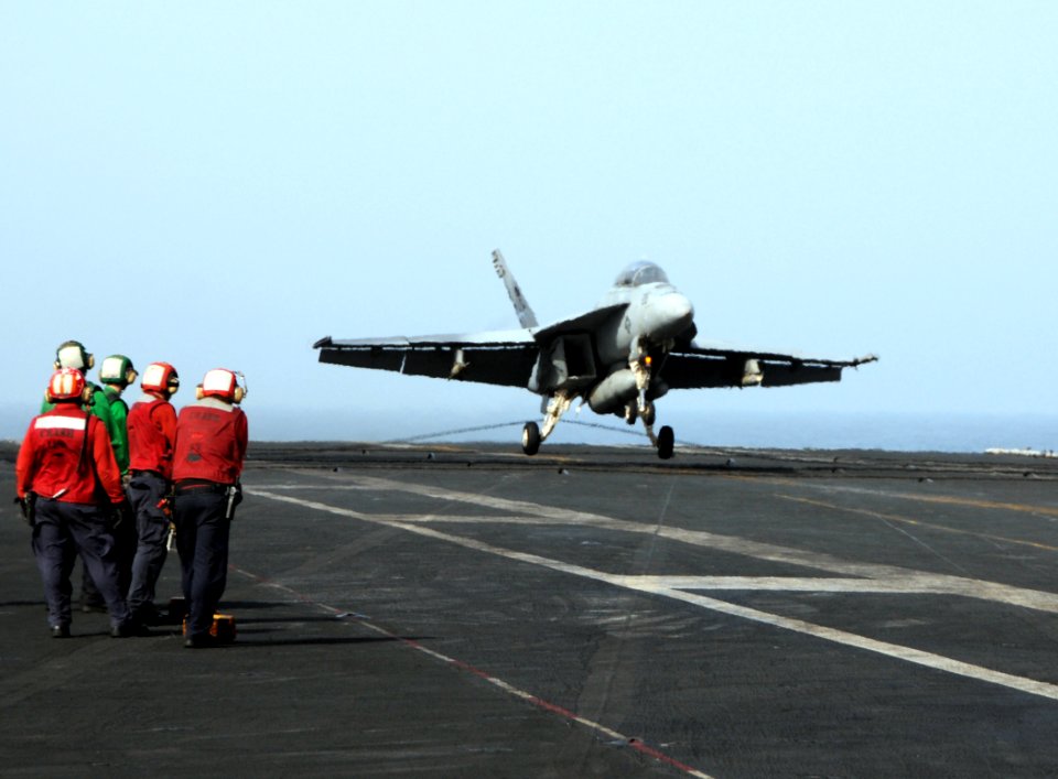US Navy 100523-N-4236E-292 An F-A-18F Super Hornet assigned to the Jolly Rogers of Strike Fighter Squadron (VFA) 103 catches an arresting cable on the flight deck of aircraft carrier USS Dwight D. Eisenhower (CVN 69)