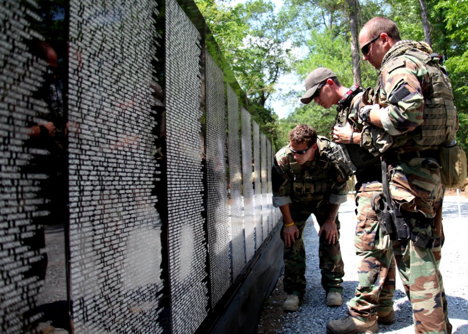 US Navy 100524-N-4205W-002 Special warfare combatant-craft crewmen read names on the Vietnam Traveling Memorial Wall during the annual Trail of Honor