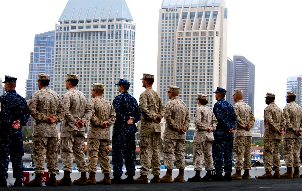 US Navy 100522-N-7948R-426 Sailors and Marines man the rails aboard USS Peleliu (LHA 5) as the ship departs San Diego for a scheduled deployment