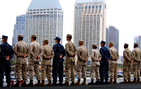 US Navy 100522-N-7948R-426 Sailors and Marines man the rails aboard USS Peleliu (LHA 5) as the ship departs San Diego for a scheduled deployment