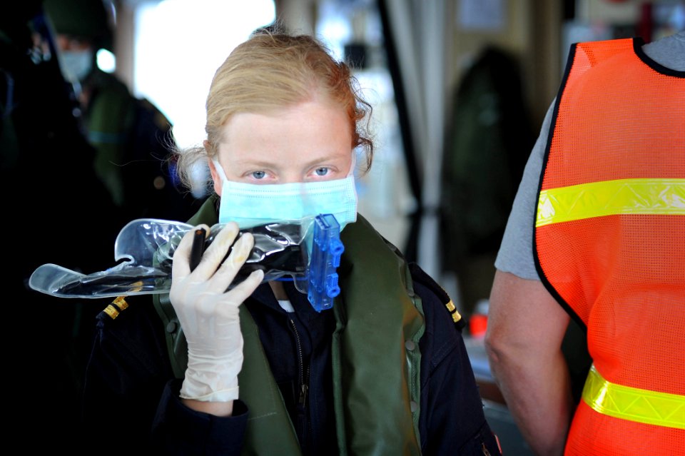 US Navy 100527-N-3136P-441 Portuguese Navy 2nd Lt. Doris Funseca, boarding officer, conducts an inspection of the Military Sealift Command container and roll-on-roll-off ship USNS LCPL Roy H. Wheat (T-AK 3016)