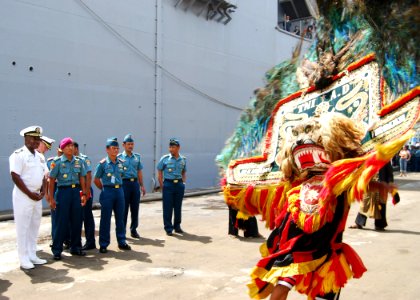 US Navy 100526-N-8539M-019 Capt. Rich Clemmons, left, Commodore of Destroyer Squadron 31, stands with officers of the Indonesian navy as they watch dancers perform a traditional welcome for the amphibious dock landing ship USS