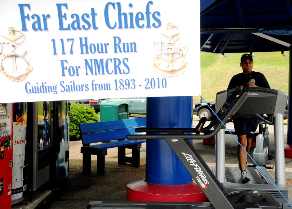 US Navy 100526-N-3283P-152 Senior Chief Navy Counselor Johannes Gonzalez runs on a treadmill to raise money for the Navy and Marine Corps Relief Society during the Far East Chiefs 117-Hour Run