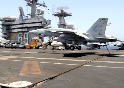 US Navy 100527-N-4236E-018 An F-A-18E Super Hornet assigned to the Pukin Dogs of Strike Fighter Squadron (VFA) 143 catches the arresting wire aboard the aircraft carrier USS Dwight D. Eisenhower (CVN 69)