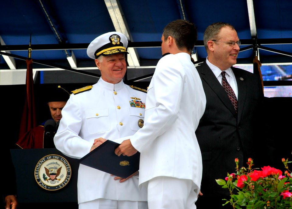 US Navy 100528-N-8273J-138 Chief of Naval Operations (CNO) Adm. Gary Roughead congratulates newly commissioned Navy ensigns during the U.S. Naval Academy Class of 2010 graduation and commissioning ceremony