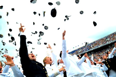 US Navy 100528-N-8273J-350 Newly commissioned officers from the U.S. Naval Academy class of 2010 celebrate the conclusion of their graduation and commissioning ceremony with the traditional hat toss at Navy-Marine Corps Memoria photo