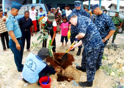 US Navy 100527-N-0995C-336 Sailors work with Indonesian volunteers to plant a jackfruit tree as part of a community service project conducted for Naval Engagement Activity Indonesia 2010