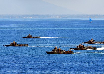 US Navy 100529-N-7643B-300 U.S. Marine Corps amphibious assault vehicles (AAV) move in formation before making an amphibious landing on the beach as part of Naval Engagement Activity (NEA) Indonesia 2010