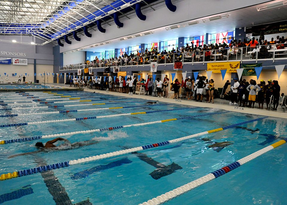 US Navy 100529-N-8689C-032 Swimmers compete while parents and coaches cheer during the 8th annual National Black Heritage Championship Swim Meet at Triangle Aquatic Center in Cary, N.C