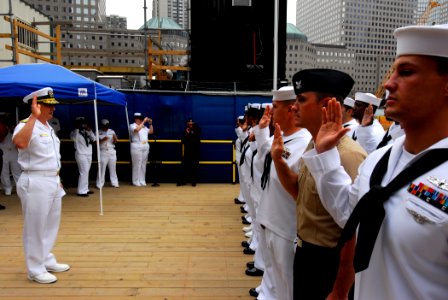 US Navy 100527-N-3154P-067 Rear Adm. Mark Boensel, commander of Navy Region Mid-Atlantic, gives the oath of enlistment to sailors during a re-enlistment ceremony at the World Trade Center site photo