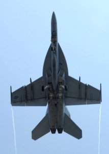 US Navy 100527-N-3620B-012 An F-A-18F Super Hornet assigned to the Fighting Checkmates of Strike Fighter Squadron (VFA) 211 flies over the aircraft carrier USS Enterprise (CVN 65)