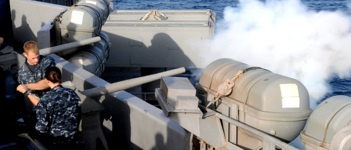 US Navy 100531-N-6935K-006 Sailors aboard the Nimitz-class aircraft carrier USS Dwight D. Eisenhower (CVN-69) render honors from the ceremonial batteries during a Memorial Day celebration