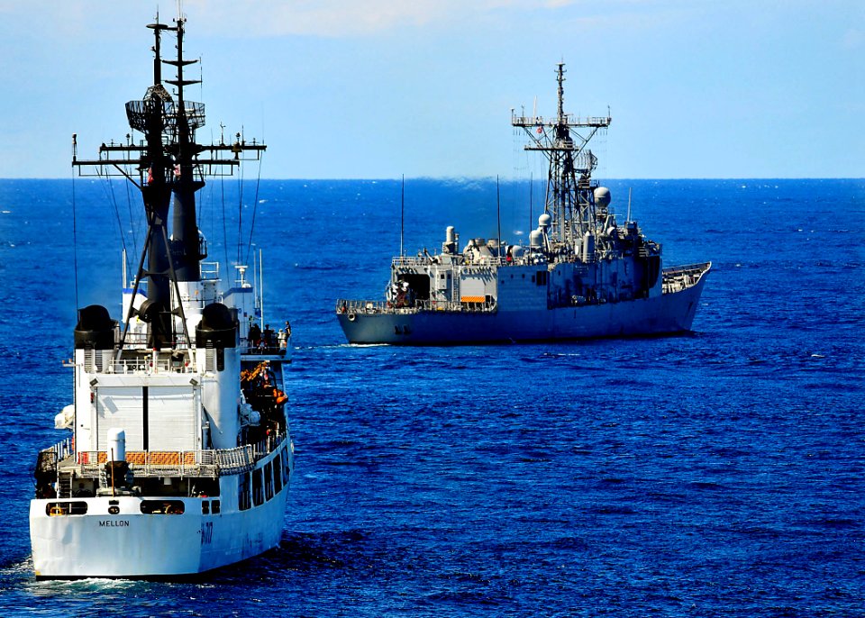 US Navy 100530-N-7643B-018 SS Vandegrift (FFG 48) and U.S. Coast Guard cutter Mellon (WHEC 717) move into position before commencing a surface gunnery exercise
