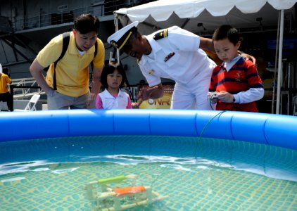 US Navy 100529-N-7676W-126 Lt. j.g. George Dabney assists patrons with the operation of Sea Pearch during Fleet Week New York City 2010