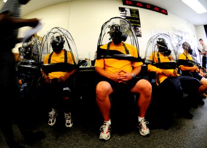 US Navy 100527-N-8607R-027 ndividual augmentee Sailors test their gas masks for leaks at Expeditionary Combat Readiness Center San Diego photo