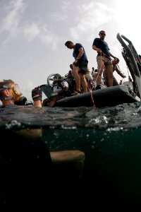 US Navy 100601-N-1134L-042 Navy Diver 2nd Class Matt Wilson, assigned to company 26 of Mobile Diving and Salvage Unit (MDSU) 2, gives the okay sign to his dive tender prior to conducting a salvage survey