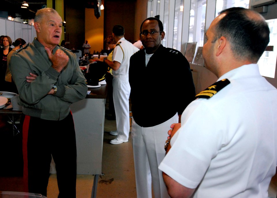 US Navy 100528-N-3154P-007 Lt. Gen. Dennis J. Hejlik, left, commanding general of 2nd Marine Expeditionary Force, and Vice Adm. Mel Williams Jr., middle, commander of U.S. 2nd Fleet, speak with Lt. Nicholas Pecci