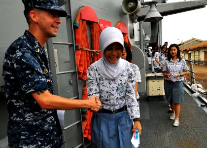 US Navy 100527-N-7643B-206 Ensign Jason Fischer thanks an Indonesian high school student for coming aboard the guided-missile frigate USS Vandegrift (FFG 48) for a tour of the ship