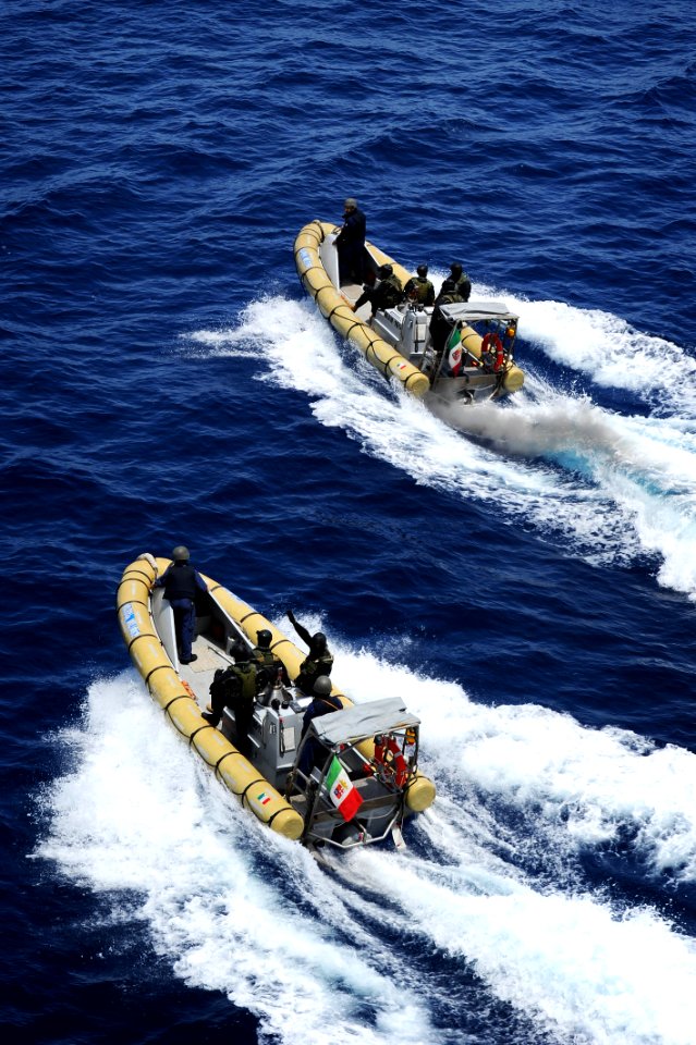 US Navy 100528-N-3136P-204 An Italian navy visit, board, search and seizure team returns to the Italian navy offshore patrol vessel ITS Comandante Foscari (P-493)