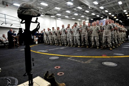 US Navy 100530-N-7364R-041 Marines attend a Memorial Day Ceremony in the turnstyle space aboard the amphibious dock landing ship USS Gunston Hall (LSD 44) photo