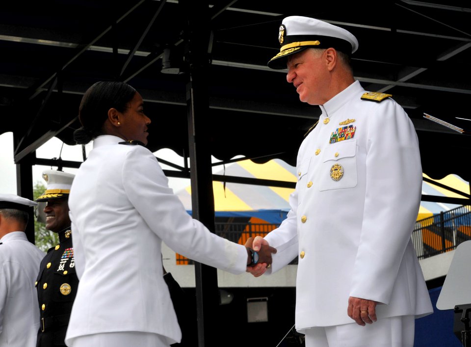 US Navy 100528-N-8273J-221 Chief of Naval Operations (CNO) Adm. Gary Roughead congratulates newly commissioned Navy ensigns during the U.S. Naval Academy Class of 2010 graduation and commissioning ceremony