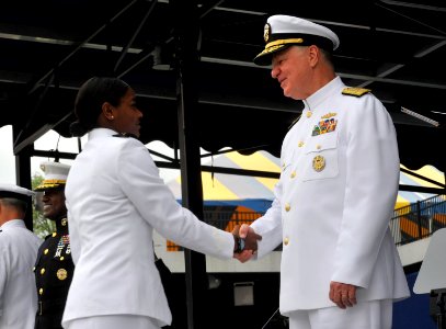US Navy 100528-N-8273J-221 Chief of Naval Operations (CNO) Adm. Gary Roughead congratulates newly commissioned Navy ensigns during the U.S. Naval Academy Class of 2010 graduation and commissioning ceremony