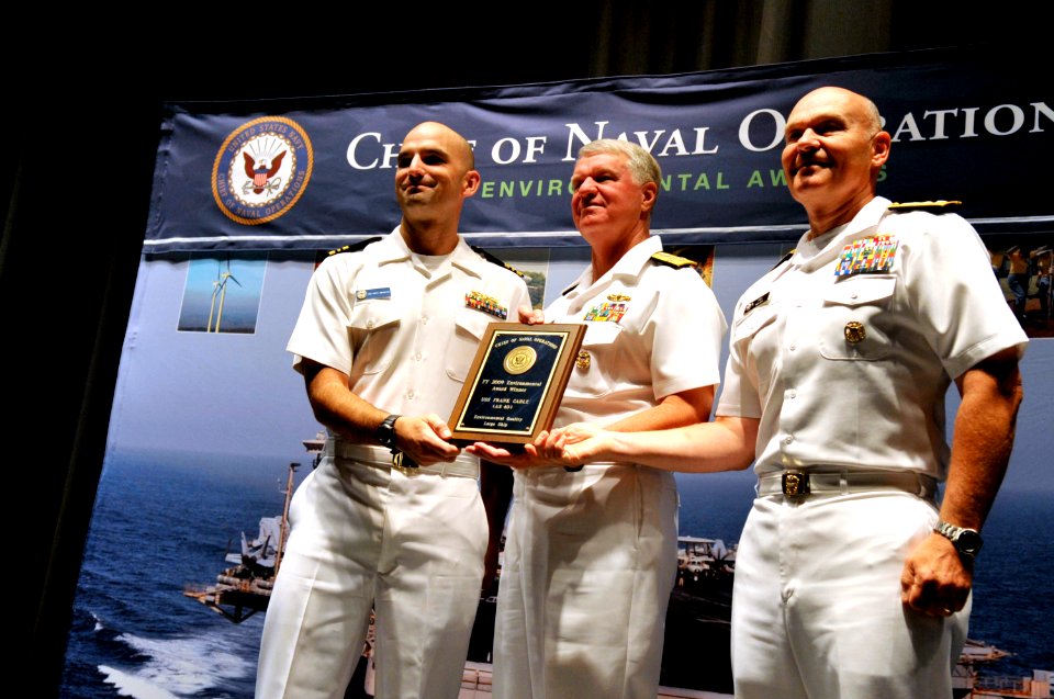 US Navy 100601-N-8273J-048 Chief of Naval Operations (CNO) Adm. Gary Roughead congratulates USS Frank Cable (AS 40) for receiving the Environmental Quality, Large Ship award