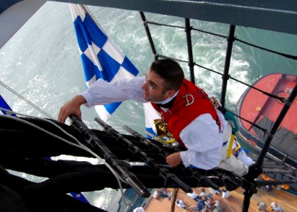 US Navy 100604-N-7642M-295 USS Constitution Command Master Chief David Twiford climbs the shrouds of the mizzen mast