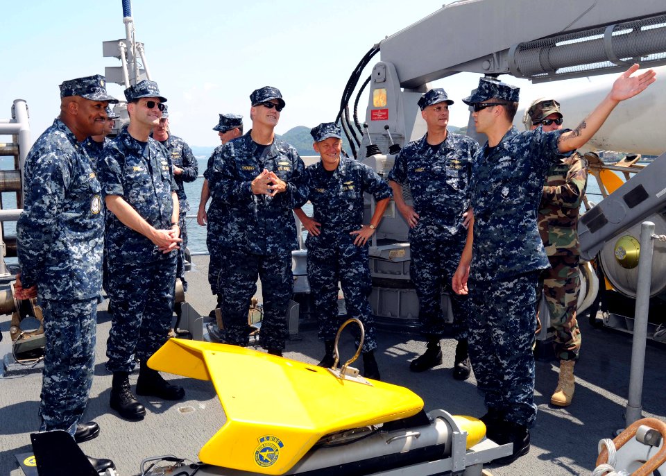 US Navy 100603-N-5538K-001 Senior leadership listen as Mineman 2nd Class Corey Swartz, right, explains the function of various equipment