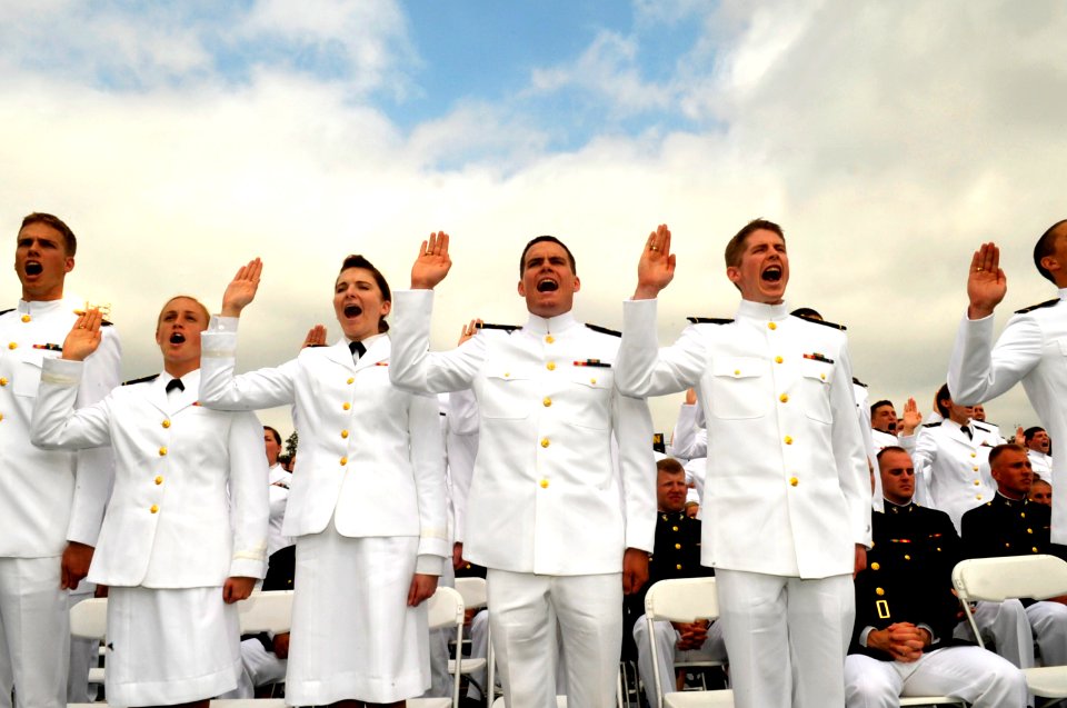 US Navy 100528-N-8273J-120 Midshipmen take the oath of office during the U.S. Naval Academy Class of 2010 graduation and commissioning ceremony at Navy-Marine Corps Memorial Stadium in Annapolis, Md