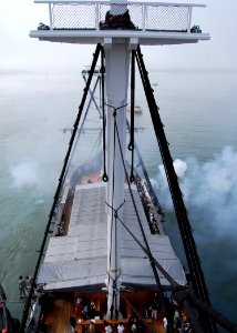 US Navy 100604-N-7642M-268 USS Constitution fires a 24-pound long gun during a 21-gun salute exchange between USS Constitution and Fort Independence on Castle Island