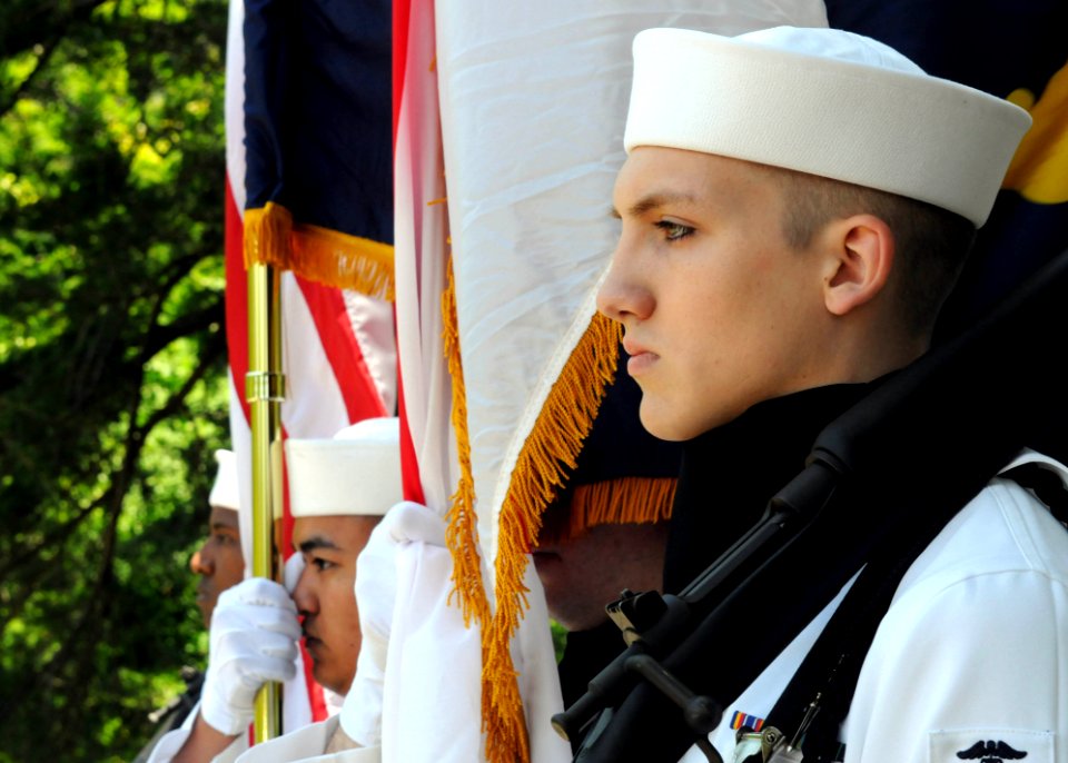 US Navy 100530-N-5538K-003 Hospital Corpsman Seaman Brian Campbell stands by with other ceremonial color guard members during a memorial ceremony for the American prisoners of war and Japanese citizens that perished during the