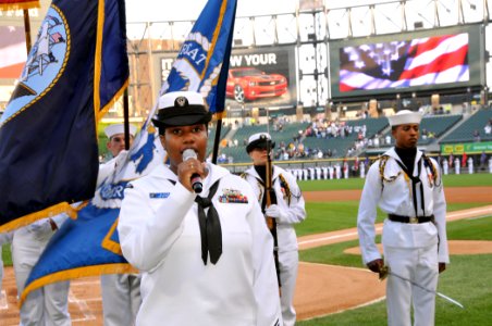 US Navy 100602-N-8848T-428 Fire Controlman 1st Class Jocelyn Elmore sings the national anthem during the 25th annual Chicago White Sox Navy Night