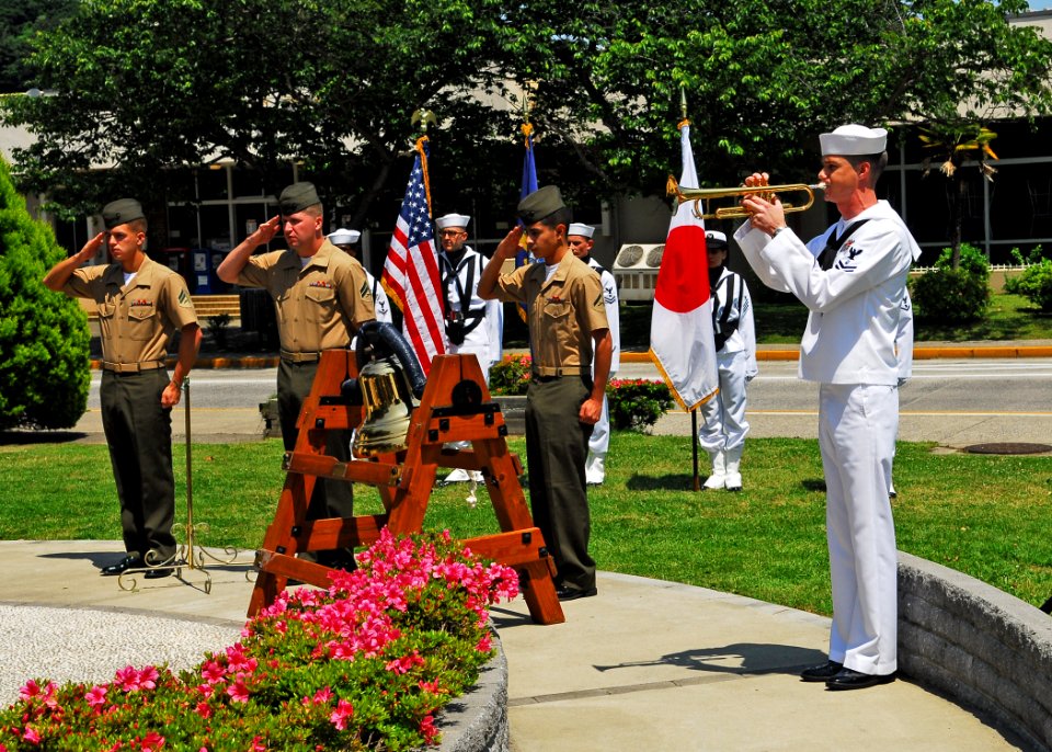 US Navy 100531-N-2218S-002 Musician 2nd Class Collin Reichow, from Hendon, Va., plays taps at a Memorial Day ceremony at the USS Oneida memorial at Fleet Activities Yokosuka