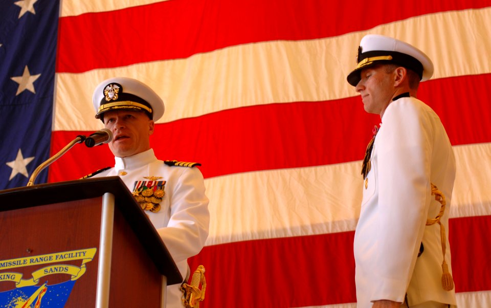 US Navy 100604-N-0535P-165 Capt. Nicholas Mongillo recites his order as Capt. Aaron Cudnohufsky looks on during the change of command ceremony at Pacific Missile Range Facility
