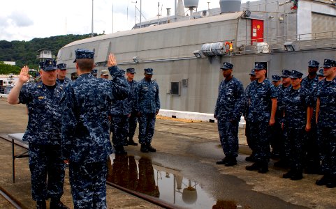 US Navy 100601-N-4971L-046 Chief Boatswain's Mate Robert Frost takes the oath of reenlistment on the pier near the Bridge of the Americas in Balboa-Rodman, Panama