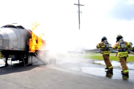 US Navy 100601-N-2468S-001 Firefighters assigned to Naval Construction Battalion Center Gulfport put out a fire during a semi-annual live aircraft fire training exercise