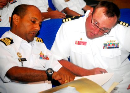 US Navy 100607-N-0995C-025 Cmdr. Steve Prescott, right, commanding officer of the guided-missile frigate USS Vandegrift (FFG 48)