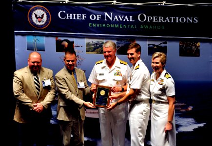US Navy 100601-N-8273J-031 Chief of Naval Operations (CNO) Adm. Gary Roughead congratulates Naval Air Station Pensacola for receiving the Natural Resources Conservation, Small Installation award