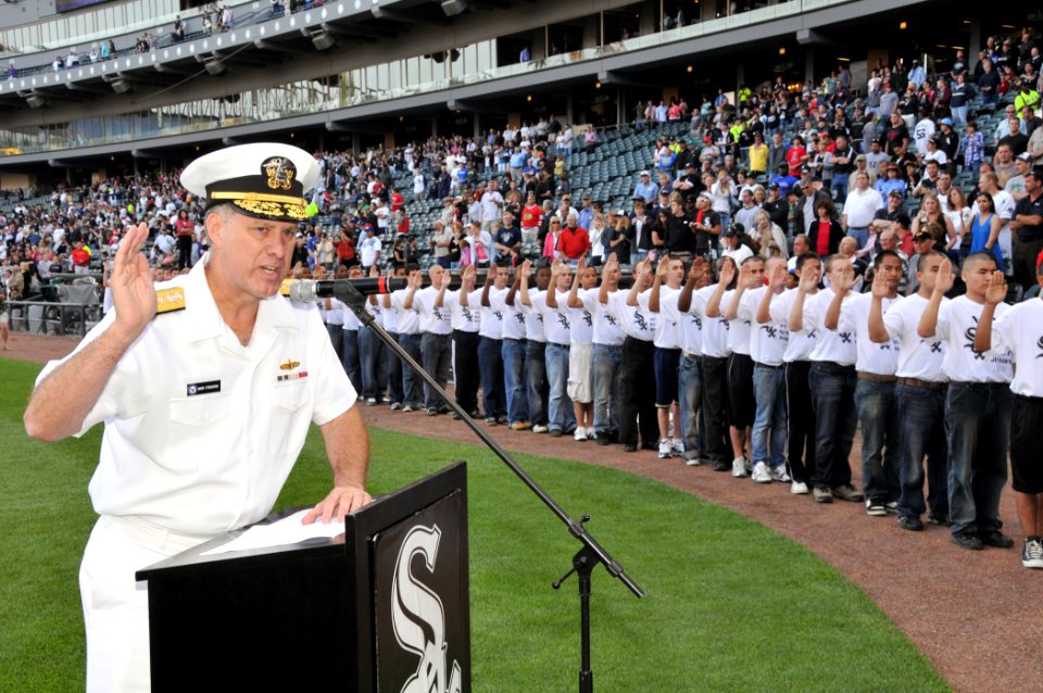 US Navy 100602-N-8848T-413 Vice Adm. Mark Ferguson, Chief of Naval Personnel, enlists 88 new recruits from the Chicago area, Indiana, and Wisconsin at the 25th annual Chicago White Sox Navy Night