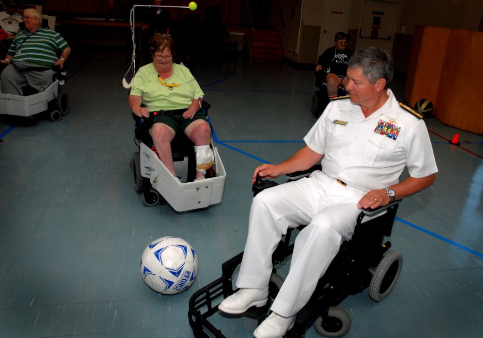 US Navy 100607-N-5208T-001 Rear Adm. Gerald R. Beaman plays a power chair soccer match with rehabilitating veterans at the Milwaukee VA Medical Center