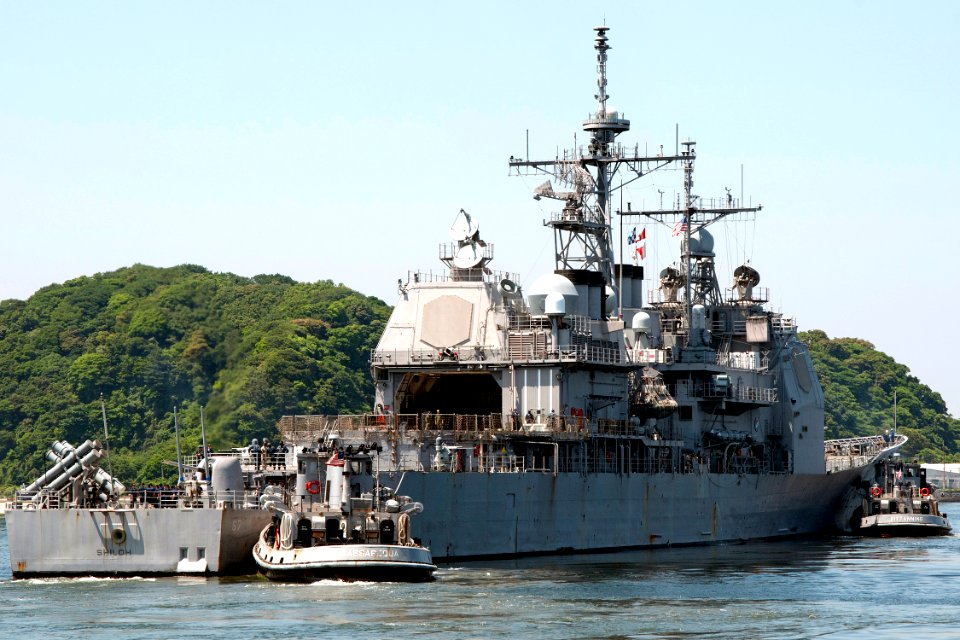 US Navy 100602-N-9123L-005 The guided-missile cruiser USS Shiloh (CG 67) receives assistance from the large harbor tugs USS Massapequa (YTB 807), left and USS Kittanning (YTB 787) while departing Commander, Fleet Activities Yok