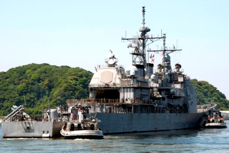 US Navy 100602-N-9123L-005 The guided-missile cruiser USS Shiloh (CG 67) receives assistance from the large harbor tugs USS Massapequa (YTB 807), left and USS Kittanning (YTB 787) while departing Commander, Fleet Activities Yok