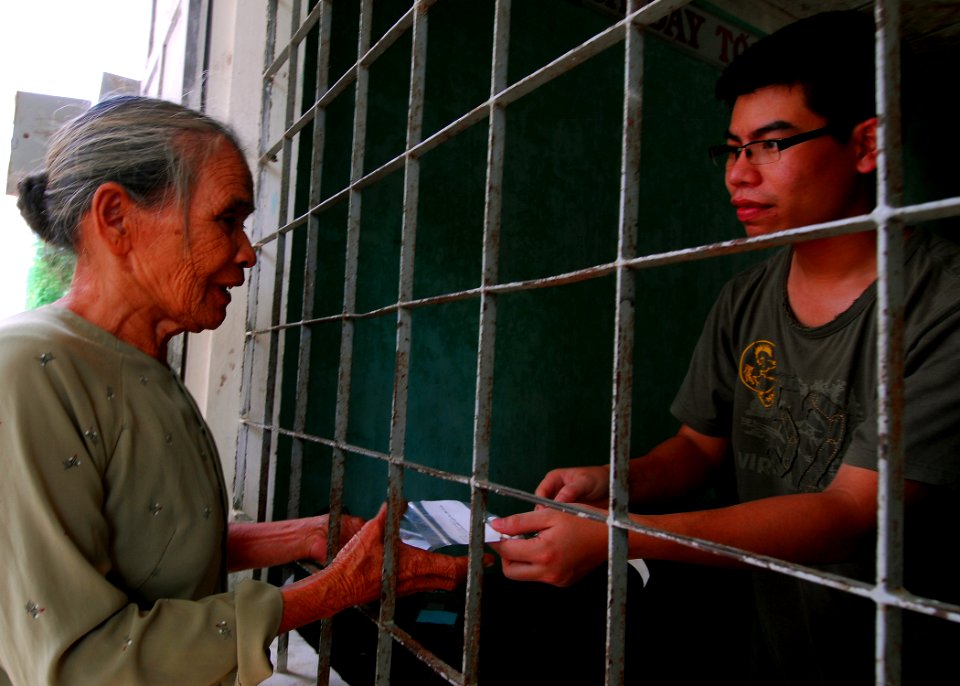 US Navy 100606-N-4044H-169 A Vietnamese translator helps distribute medications to a Vietnamese patient during a Pacific Partnership 2010 medical civic action program