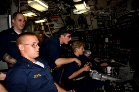 US Navy 100603-N-0000X-053 Midshipmen learn to pilot the submarine by training in the duties of the helm and planesman while underway aboard the Ohio-class ballistic-missile submarine USS West Virginia (SSBN 736)