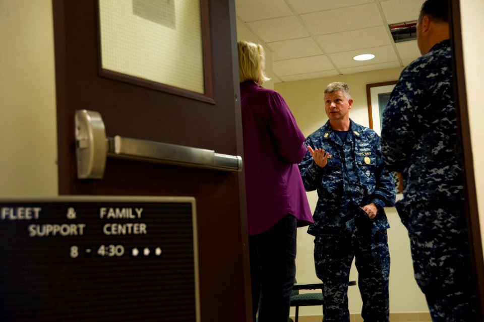 US Navy 100604-N-7526R-318 Master Chief Petty Officer of the Navy Rick West speaks with the Naval Station Rota, Spain, Fleet and Family Support Center director during a tour of the installation