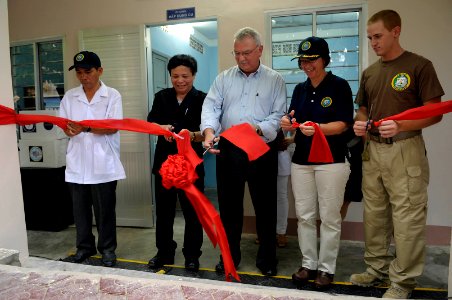 US Navy 100604-N-6410J-220 Pacific Partnership representatives cut a ribbon with a Ministry of Health of Vietnam official and a Quang Trung Hospital physician during a rededication ceremony