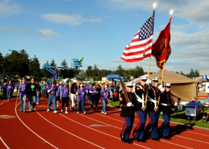 US Navy 100604-N-9860Y-003 Members of the Marine Aviation Training Support Group (MATSG) 53 Color Guard parade the colors during the opening ceremony of the 2010 Relay For Life of North Whidbey at North Whidbey Middle School