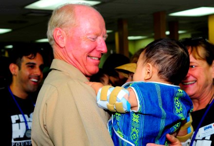 US Navy 100608-N-6410J-185 Adm. Robert F. Willard, commander of U.S. Pacific Command, holds a Vietnamese child during his visit to the pediatric ward aboard the Military Sealift Command hospital ship USNS Mercy (T-AH 19)