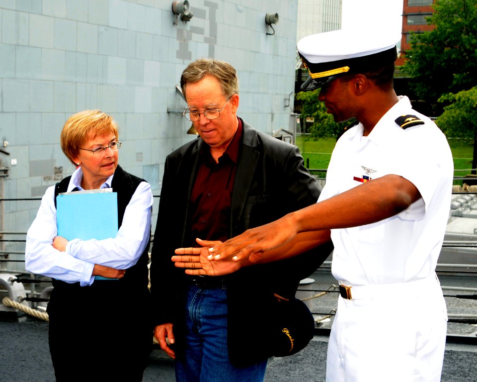 US Navy 100606-N-2143T-002 Ensign Kareem Washington gives a personal ship tour to Thomas Sampson and his wife Martha during the Portland Rose Festival and Fleet Week celebration